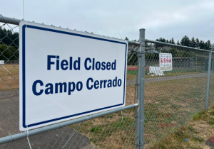 Field closed sign on a chain link fence