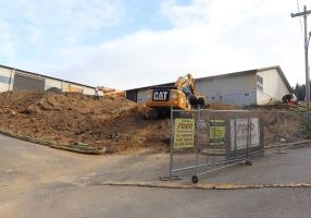 Backhoe on a mound of dirt
